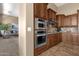 Spacious kitchen featuring double ovens and ample wood cabinetry at 127 E Sabrosa Dr, New River, AZ 85087