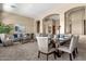 Formal dining room with seating for six and a view to the living room at 127 E Sabrosa Dr, New River, AZ 85087