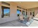 Covered patio with seating area, ideal for outdoor dining at 127 E Sabrosa Dr, New River, AZ 85087