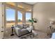 Relaxing sitting area with large windows and comfortable seating at 127 E Sabrosa Dr, New River, AZ 85087