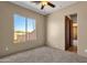 Spacious bedroom with large window and carpeted floor at 127 E Sabrosa Dr, New River, AZ 85087