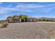 House exterior with desert landscaping and a three-car garage at 127 E Sabrosa Dr, New River, AZ 85087