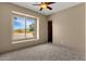 Bright bedroom with large window and carpeted floor at 127 E Sabrosa Dr, New River, AZ 85087