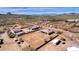 Aerial view of a house and surrounding desert landscape at 127 E Sabrosa Dr, New River, AZ 85087