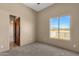 Bright bedroom with large window and view of the desert landscape at 127 E Sabrosa Dr, New River, AZ 85087