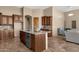 Kitchen with island, granite countertops, and wood cabinets at 127 E Sabrosa Dr, New River, AZ 85087