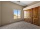 Bright bedroom with large closet and carpeted floor at 127 E Sabrosa Dr, New River, AZ 85087