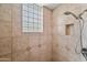 Shower stall with glass block window and tile surround at 26601 N Aguila Rd, Rio Verde, AZ 85263