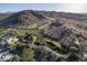 Aerial view of golf course and surrounding desert landscape at 4710 E Winston Dr, Phoenix, AZ 85044