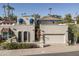 Two-story home with tile roof, two-car garage, and landscaping at 4710 E Winston Dr, Phoenix, AZ 85044