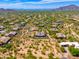 Aerial view of a luxury home community with desert landscape and mountain views at 8563 E Tumbleweed Dr, Scottsdale, AZ 85266