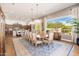 Open dining room with a view into the kitchen and hardwood floors at 8563 E Tumbleweed Dr, Scottsdale, AZ 85266