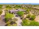 Aerial view of a beautiful home with a long driveway at 8563 E Tumbleweed Dr, Scottsdale, AZ 85266