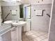 Bathroom with double vanity, tiled floor and shower at 5113 W Harmont Dr, Glendale, AZ 85302