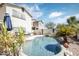 Inviting kidney shaped pool with a waterfall feature and lounge chairs at 3629 W Amerigo Ct, Anthem, AZ 85086