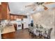 Eat-in kitchen with wood cabinets, granite counters, and modern appliances at 6565 N 19Th Ave # 21, Phoenix, AZ 85015