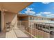 Private balcony with table and chairs, overlooking the community at 6565 N 19Th Ave # 21, Phoenix, AZ 85015