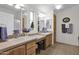 Bathroom with double sinks, tiled floor, and plenty of cabinet space at 437 E Germann Rd # 146, San Tan Valley, AZ 85140