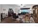 Living room with dark leather sofa and piano at 437 E Germann Rd # 146, San Tan Valley, AZ 85140