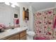 Charming bathroom with floral shower curtain and single sink vanity at 437 E Germann Rd # 146, San Tan Valley, AZ 85140
