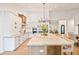 Modern kitchen with a large island, stainless steel appliances, and white cabinets at 8513 E Belgian Trl, Scottsdale, AZ 85258