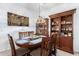 Dining room with a round table, wooden chairs, and a china cabinet at 1451 E Palm Beach Dr, Chandler, AZ 85249