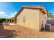 Tan house exterior with gravel landscaping and AC unit at 1451 E Palm Beach Dr, Chandler, AZ 85249