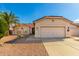 Single-story home with desert landscaping, two-car garage, and neutral color scheme at 1451 E Palm Beach Dr, Chandler, AZ 85249
