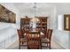 Bright dining area with wood table and chairs, plus a china hutch at 1451 E Palm Beach Dr, Chandler, AZ 85249