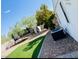 View of backyard, showing artificial turf and patio at 9693 E Frito Ave, Mesa, AZ 85208
