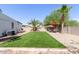 Backyard oasis with artificial turf and patio at 9693 E Frito Ave, Mesa, AZ 85208