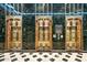 Elegant building lobby with three brass elevators at 114 W Adams St # 808, Phoenix, AZ 85003
