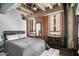 Large bedroom with exposed brick and city views at 114 W Adams St # 808, Phoenix, AZ 85003
