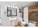 Clean bathroom with a pedestal sink and shower/tub combo at 114 W Adams St # 808, Phoenix, AZ 85003