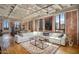 Open living area with exposed brick and large windows at 114 W Adams St # 808, Phoenix, AZ 85003
