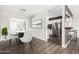 Bright dining area with modern table and chairs, open to the kitchen at 5510 E Colby St, Mesa, AZ 85205