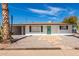 Charming single story home with a green door and stone pathway at 5510 E Colby St, Mesa, AZ 85205