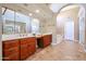 Elegant bathroom with a double vanity and a soaking tub at 13302 W Serenade Cir, Sun City West, AZ 85375