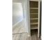 Open shelving and hanging space in this closet at 20411 N 99Th Dr, Peoria, AZ 85382