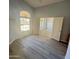 Spacious office with light blue walls and vinyl plank flooring at 20411 N 99Th Dr, Peoria, AZ 85382
