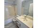 Clean bathroom with a single sink, shower/tub combo at 20411 N 99Th Dr, Peoria, AZ 85382