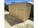 Tan metal storage shed with side door at 20411 N 99Th Dr, Peoria, AZ 85382