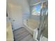 Clean bathroom with a bathtub and a shower at 20411 N 99Th Dr, Peoria, AZ 85382