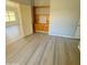 Bright dining room with built-in shelving and wood-look flooring at 20411 N 99Th Dr, Peoria, AZ 85382