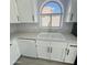 Clean lines and a double sink with elegant faucet in the kitchen at 20411 N 99Th Dr, Peoria, AZ 85382