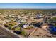 Aerial view of a house with a pool and surrounding desert landscape at 9645 E Brown Rd, Mesa, AZ 85207