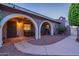 Relaxing patio area with hanging chairs and arches at 9645 E Brown Rd, Mesa, AZ 85207