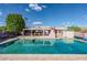 Sparkling pool with large patio and covered dining area at 9645 E Brown Rd, Mesa, AZ 85207