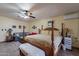 Main bedroom with king-size bed and sitting area at 9645 E Brown Rd, Mesa, AZ 85207