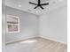 Simple bedroom with gray walls, wood-look floors, and a window at 2122 W Virginia Ave, Phoenix, AZ 85009